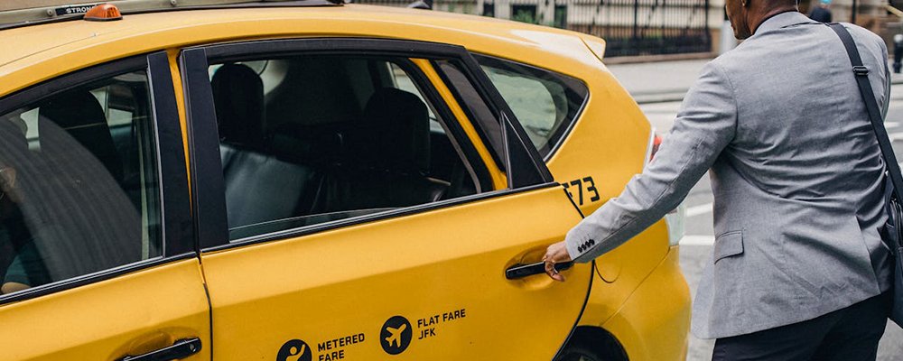 6 Taxi Scams To Avoid (in 2024) - The Wise Traveller - Guy getting into Taxi